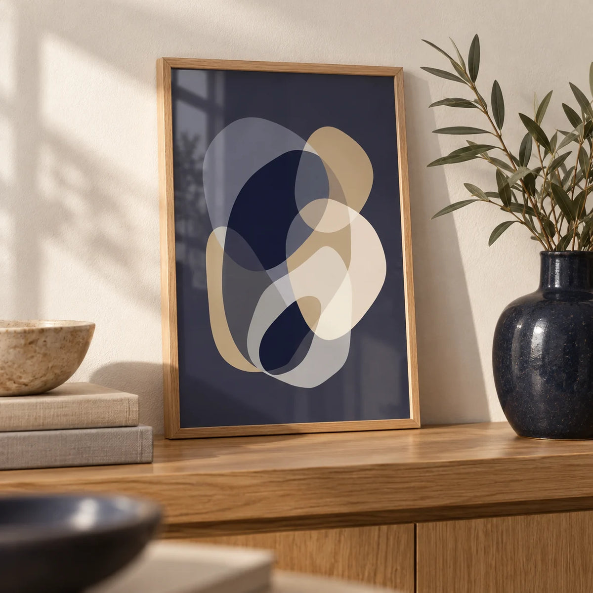 Prints Abstract Art, a small A4 framed print leaning on an oak shelf in a living room