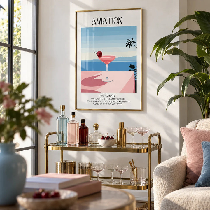 Prints of Cocktails, framed on the wall of a bright living room corner with a white wall