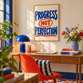 Progress Not Perfection Print, framed on the wall of a bright in a home office