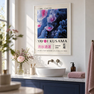 Purple Abstract Wall Art, framed on the wall of a calm bathroom with plain white walls and a plain indigo painted vanity