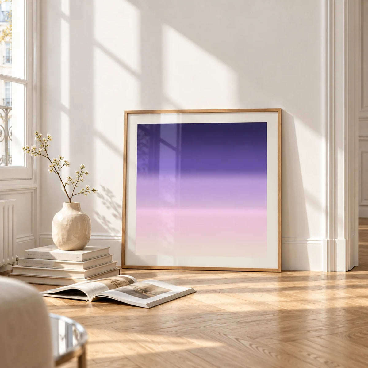Purple and Pink Wall Art, framed and leaning on the parquet floor of a bright living room