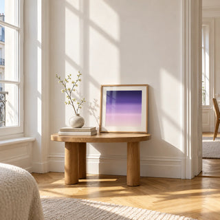 Purple and Pink Wall Art, a small square framed print leaning on a small solid oak side table