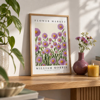 Purple Floral Wall Art, a small A4 framed print leaning on an oak shelf in a living room