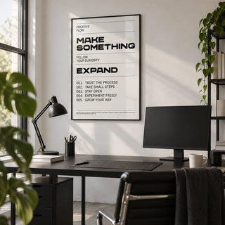 Quotes for Room Wall, framed on the wall of a graphic designer's studio with a white wall and a concrete floor in a home office