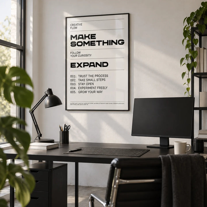 Quotes for Room Wall, framed on the wall of a graphic designer's studio with a white wall and a concrete floor in a home office