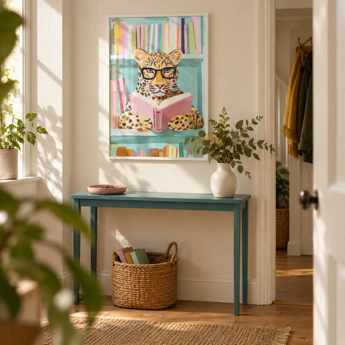 Reading Leopard Art Print, framed on the wall of a welcoming entrance hallway in a UK first flat for a book lover aged 25-35