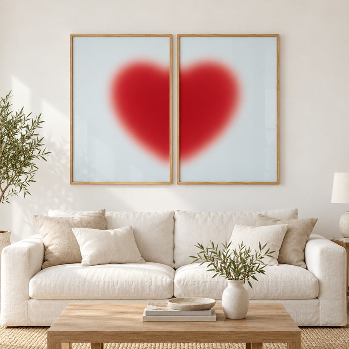 Red Heart Print Set of 2 hung at eye level above a white linen sofa: Cherry Heart Left and Cherry Heart Right shown framed side by side (frames not included)