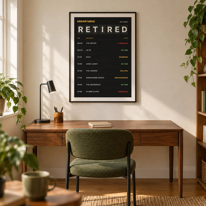 Retired Poster, framed on the wall of a modern home study in a retired couple's UK semi-detached house with a warm white wall and oak flooring