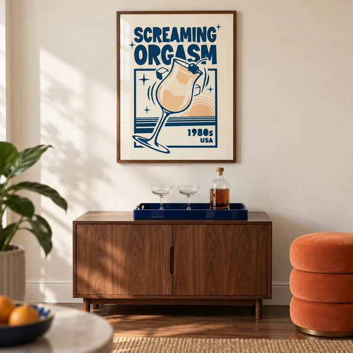 Retro Cocktail Poster, framed on the wall of a compact home bar in a design-conscious UK flat with a cream wall and walnut flooring in a living room