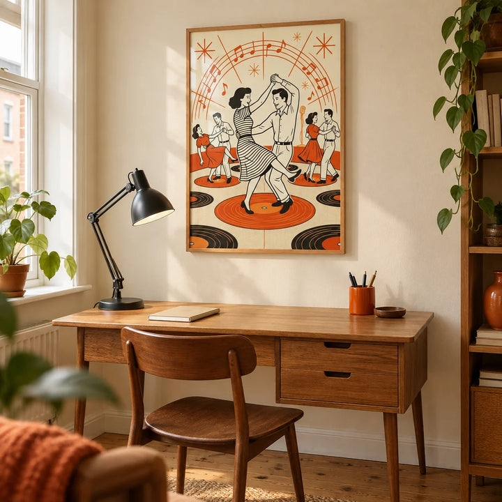Retro Dance Wall Art, framed on the wall of a compact home study in a UK flat with a warm cream wall and a mid-century oak writing desk
