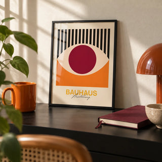 Retro Eye Wall Art, a small A4 framed print leaning on a black desk