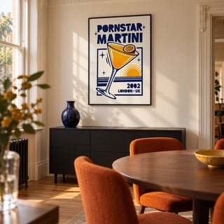 Retro Passion Fruit Martini Poster, framed on the wall of a design-led dining room in a Victorian terrace with warm ivory walls and an oak floor