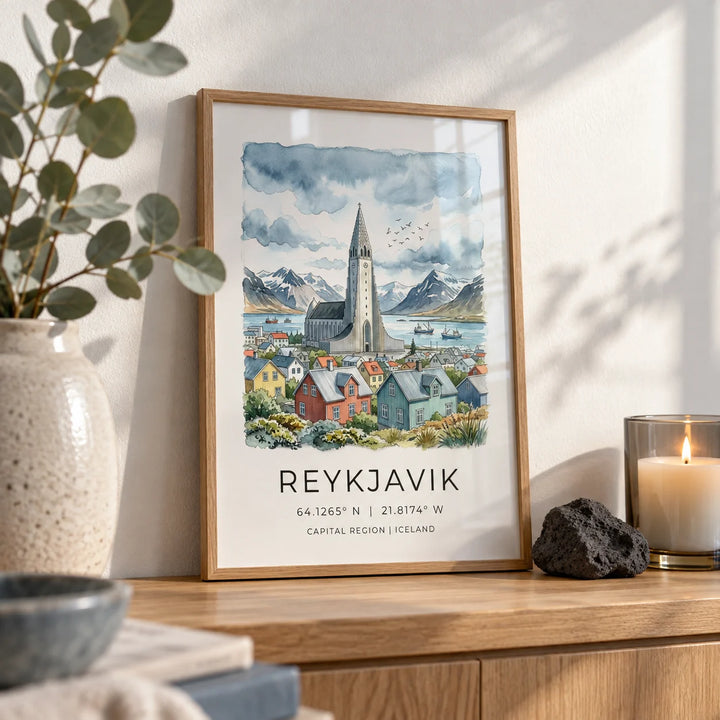 Reykjavik Watercolor Art Print, a small A4 framed print leaning on an oak shelf in a living room