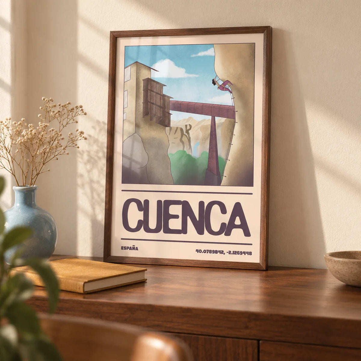 Rock Climbing Poster, a small A4 framed print leaning on a walnut desk