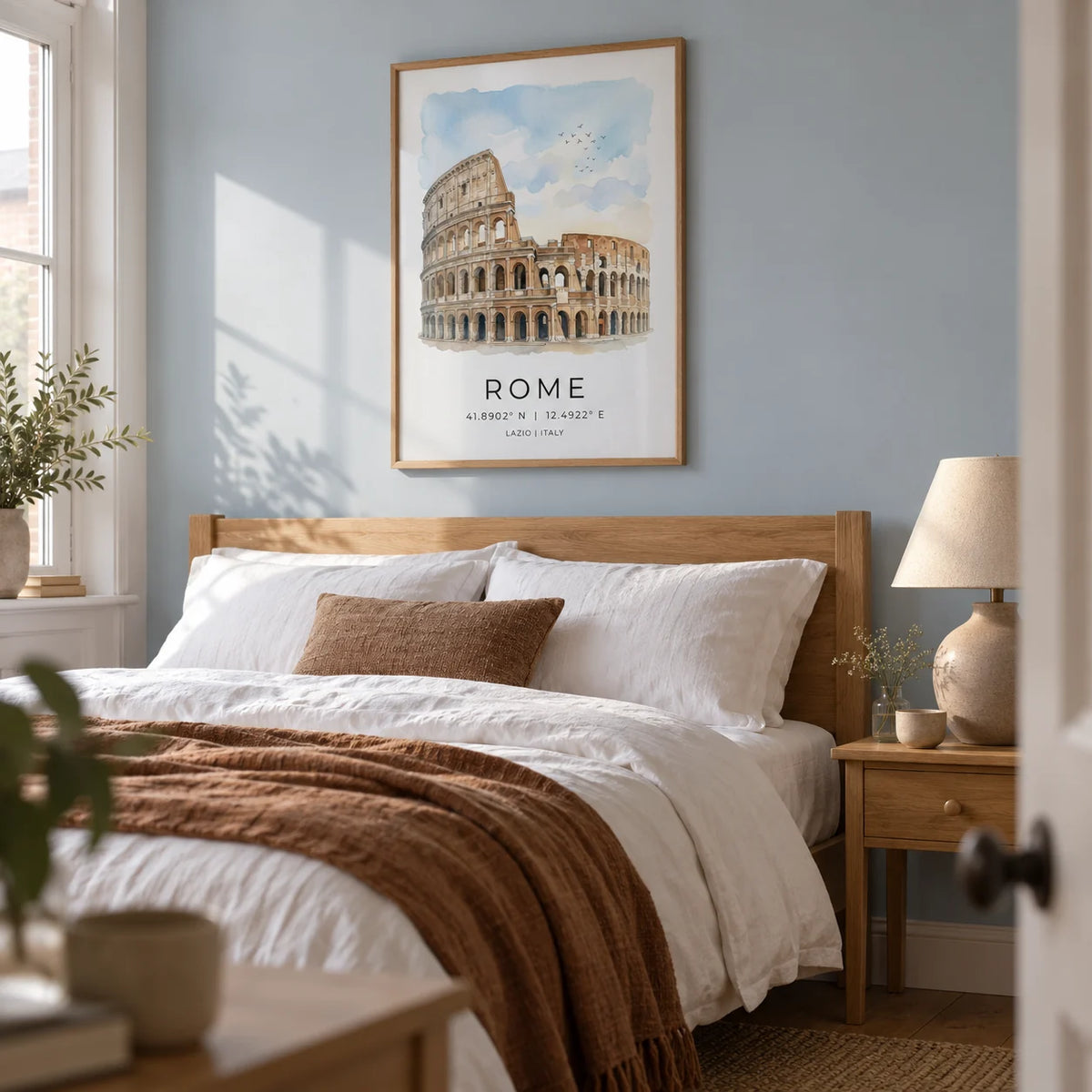 Rome Colosseum Art Print, framed on the wall of a calm adult bedroom in a UK terrace with a pale blue wall and warm timber furniture