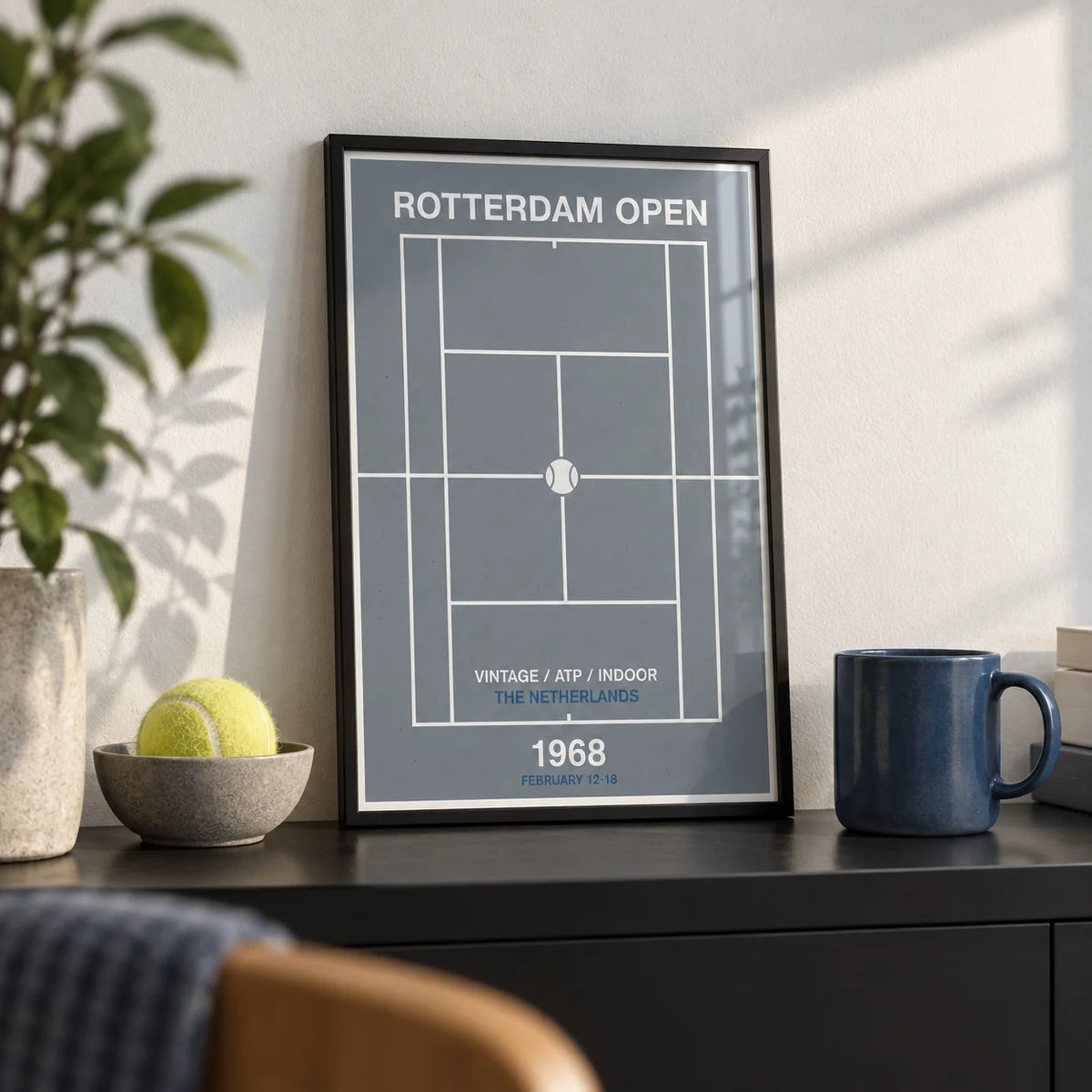 Rotterdam Open Poster, a small A4 framed print leaning on a black shelf in a living room