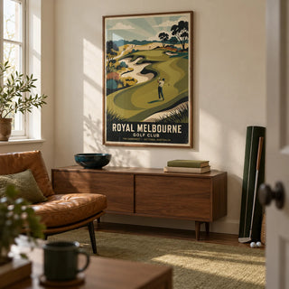 Royal Melbourne Golf Art, framed on the wall of a small converted spare-room golf snug in a UK semi-detached home with cream walls and a plain olive rug in a living room