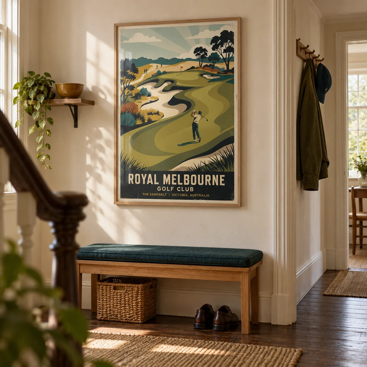 Royal Melbourne Golf Art, framed on the wall of a welcoming hallway in a British golfer's terraced house with warm cream plaster and dark wood floorboards