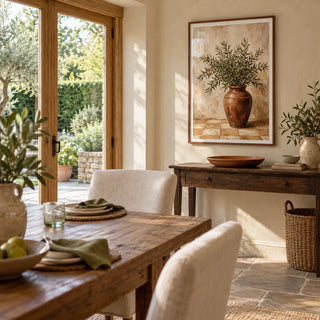 Rustic Olive Art, framed on the wall of a garden-facing dining space in a UK cottage extension with warm ivory plaster