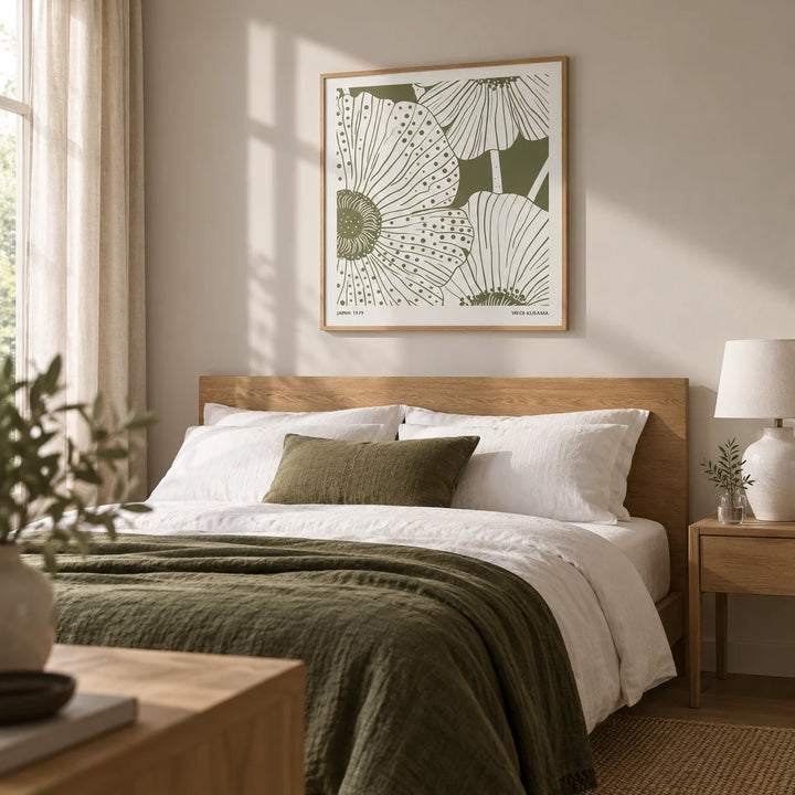 Sage Green Abstract Wall Art, framed on the wall of a restful adult bedroom with a pale warm grey wall and natural oak furniture