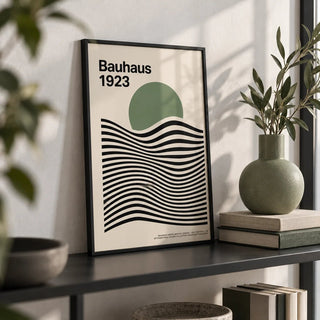 Sage Green Print, a small A4 framed print leaning on a black metal shelf in a living room