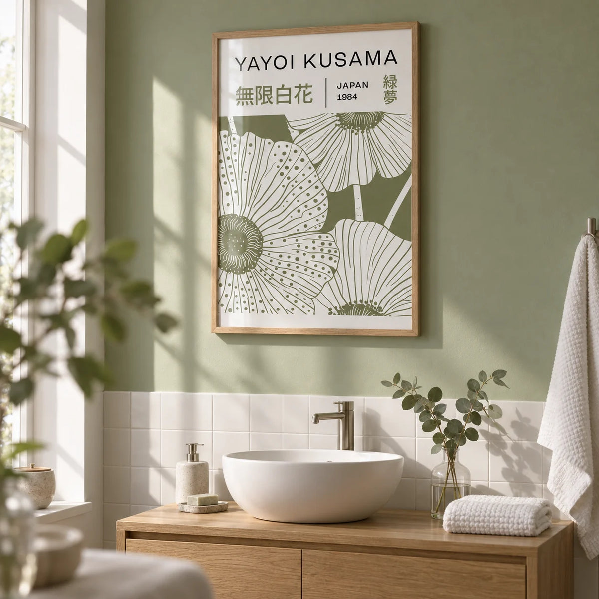 Sage Green Wall Art, framed on the wall of a serene bathroom with a pale sage green painted wall and plain white tiles