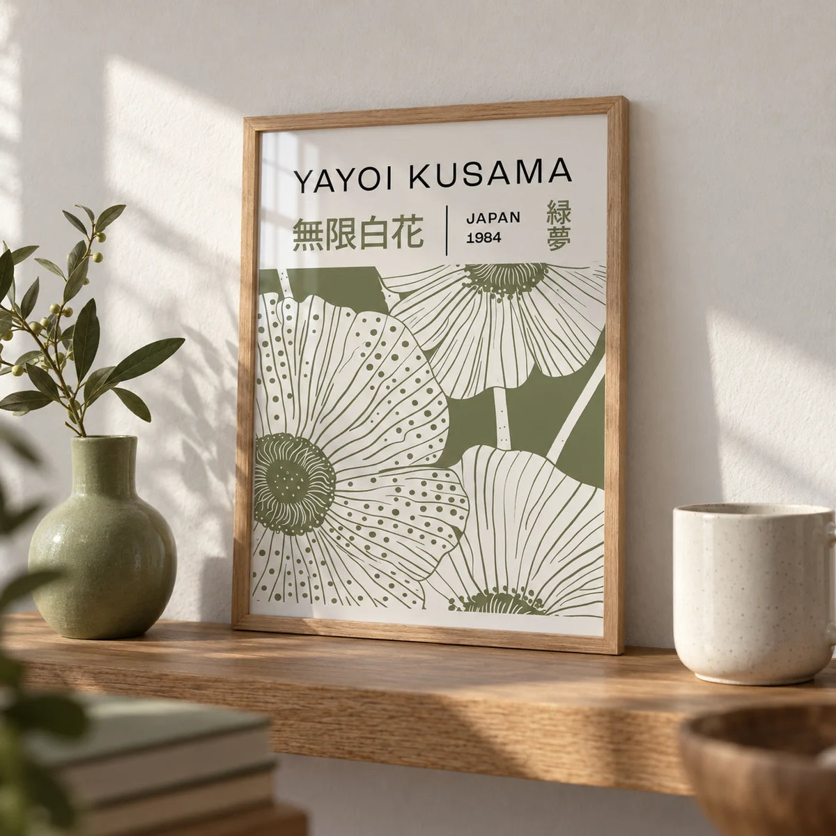 Sage Green Wall Art, a small A4 framed print leaning on an oak shelf in a living room