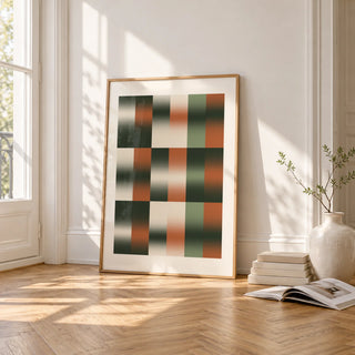 Sage Grid Print, framed and leaning on the parquet floor of a bright living room