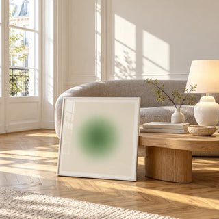 Sage Wall Art, framed and leaning against a coffee table in a bright living room