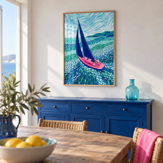 Sailboat Art Print, framed on the wall of a seaside dining room