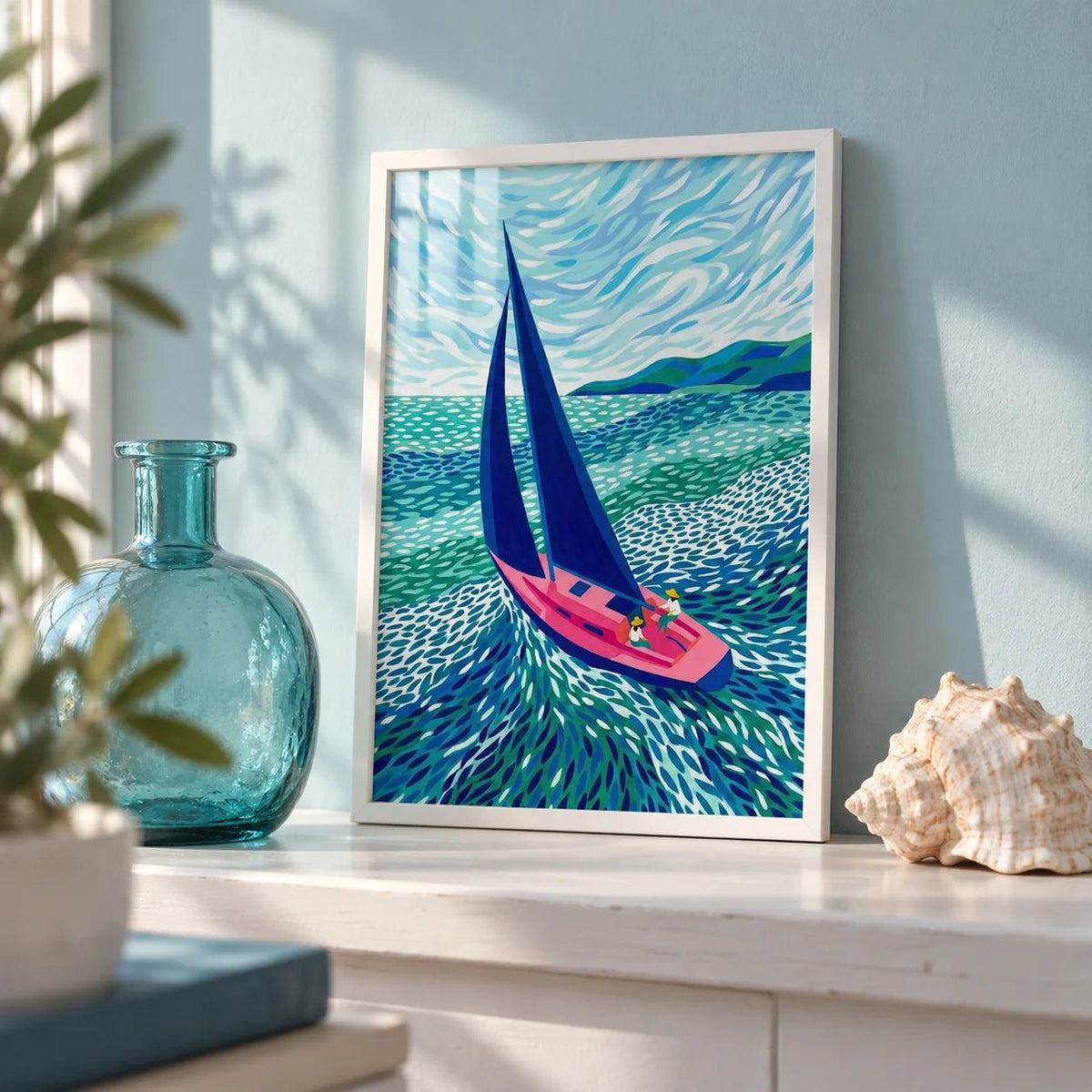 Sailboat Art Print, a small A4 framed print leaning on a white painted shelf in a living room
