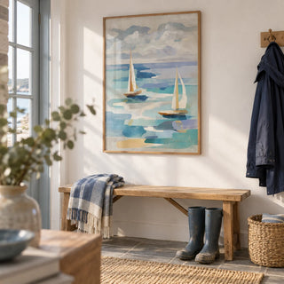 Sailboat Water Art, framed on the wall of a seaside boot room with a white wall in a hallway