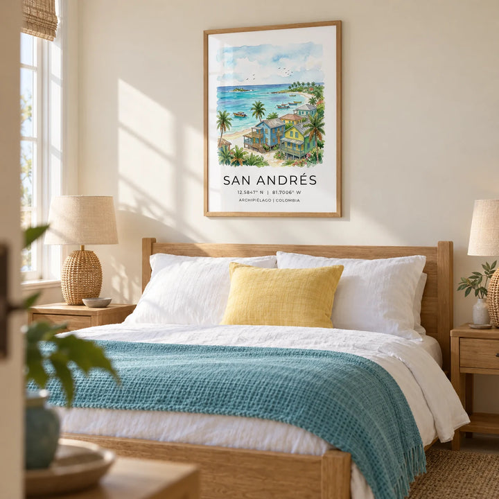 San Andres Art Print, framed on the wall of a restful coastal bedroom in a UK home with a pale cream wall and woven bedside lamps