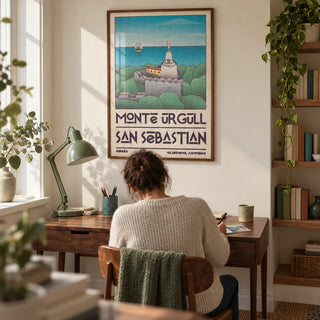 San Sebastian Art Print, framed on the wall of a compact home study in a UK flat with a cream wall and an alcove of wooden shelves