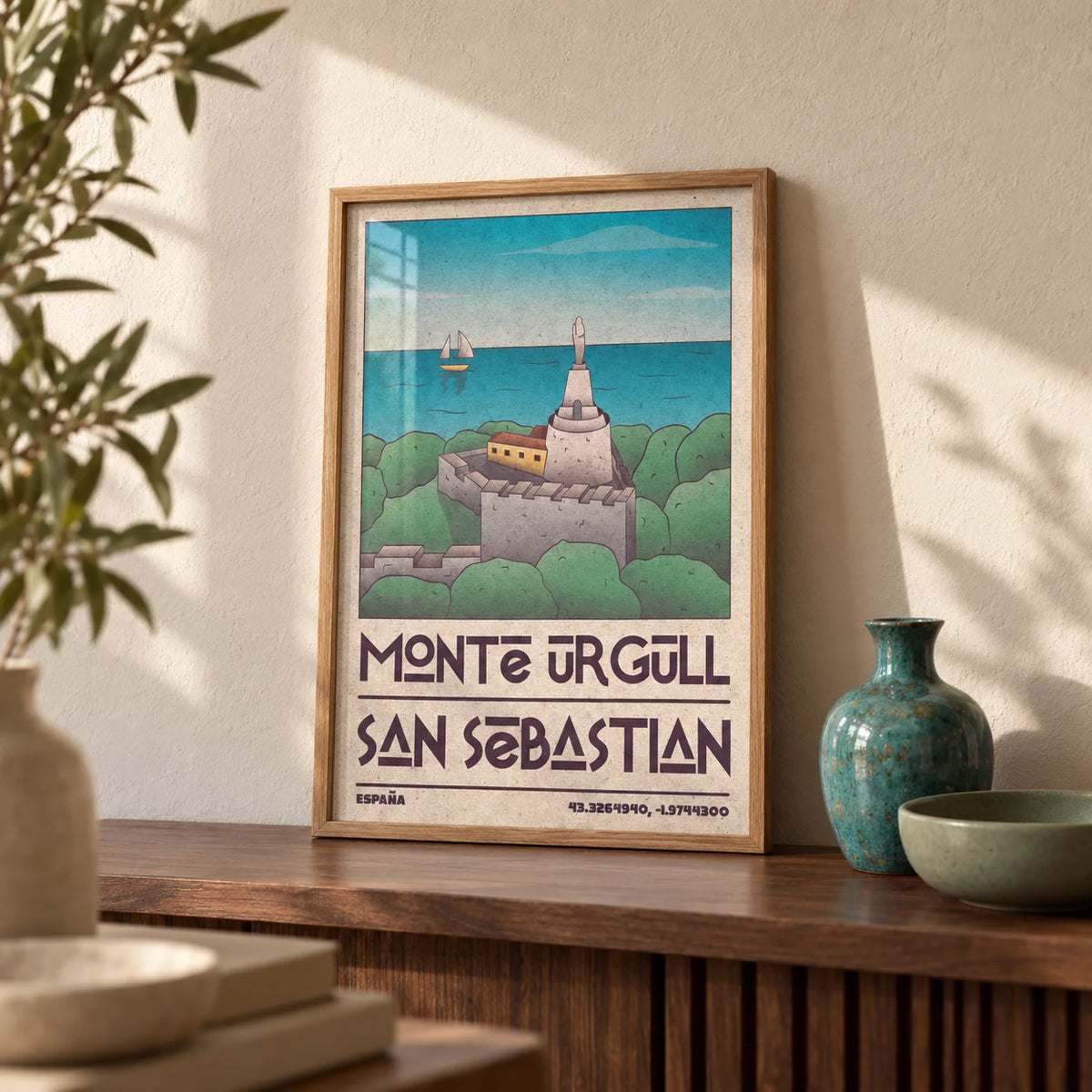 San Sebastian Art Print, a small A4 framed print leaning on a walnut shelf in a living room
