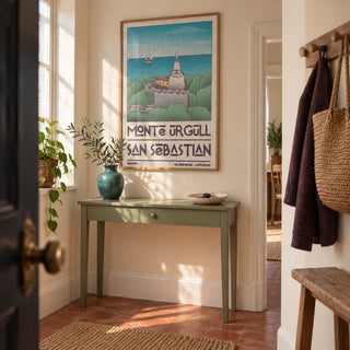 San Sebastian Art Print, framed on the wall of a welcoming hallway in a UK period flat with pale cream walls and a terracotta floor