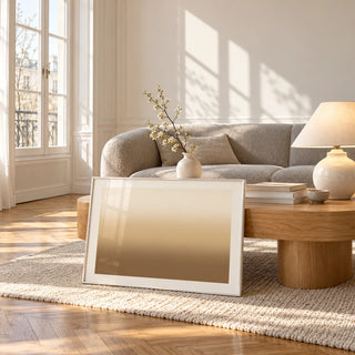 Sand Wall Art, framed and leaning against a coffee table in a bright living room
