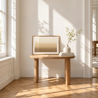 Sand Wall Art, a small A4 framed print leaning on a small solid oak side table