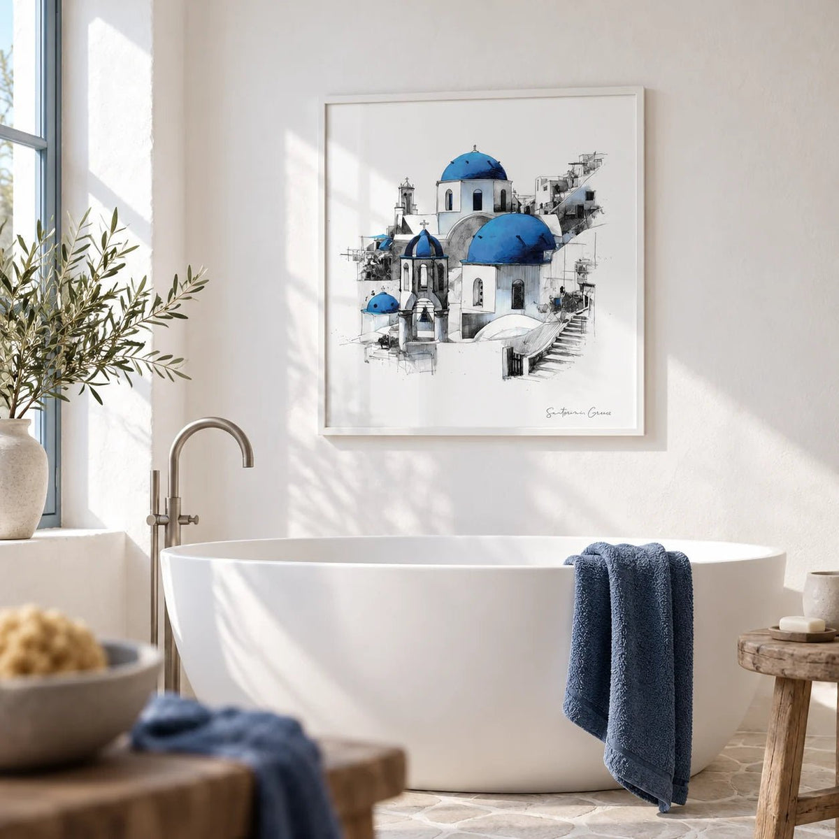 Santorini Wall Art, framed on the wall of a bright whitewashed bathroom