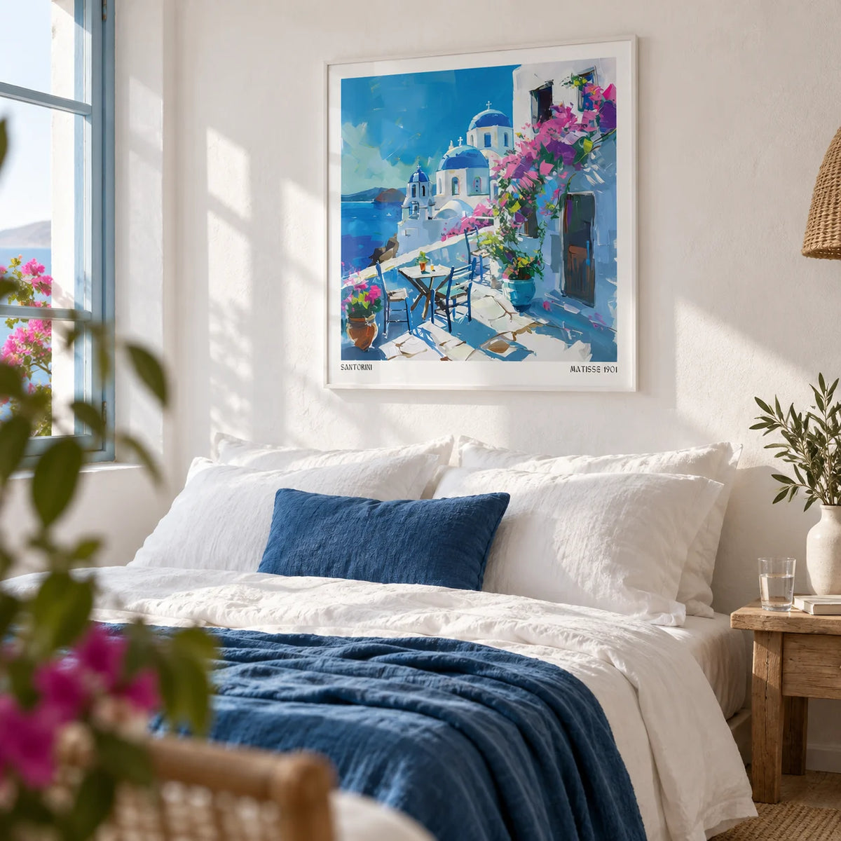Santorini Wall Art Prints, framed on the wall of a bright whitewashed bedroom