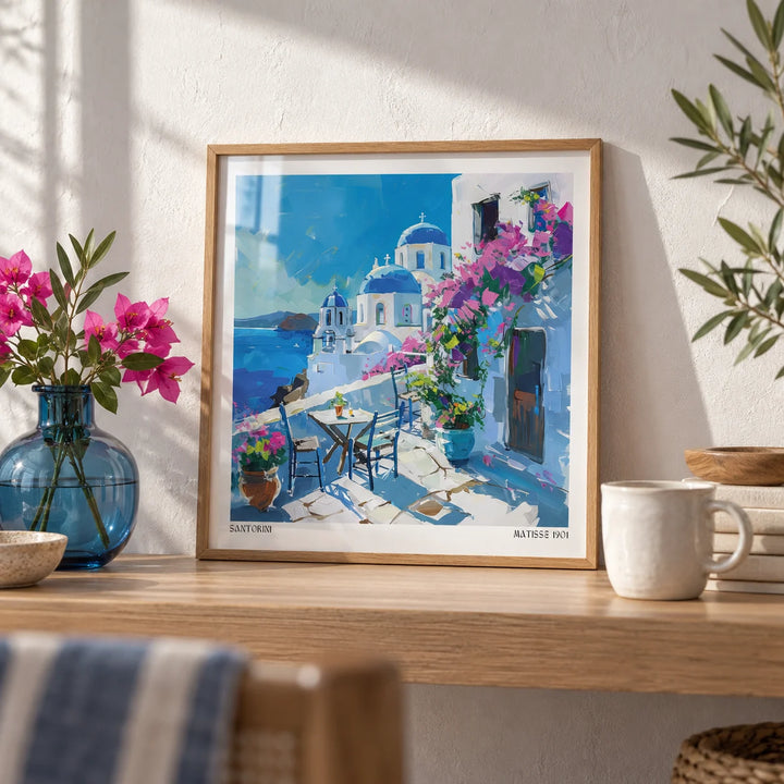 Santorini Wall Art Prints, a small A4 framed print leaning on an oak shelf in a living room