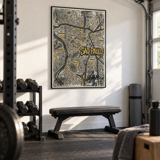 Sao Paulo Map Art, framed on the wall of a clean home gym in a garage with a white wall and black rubber flooring
