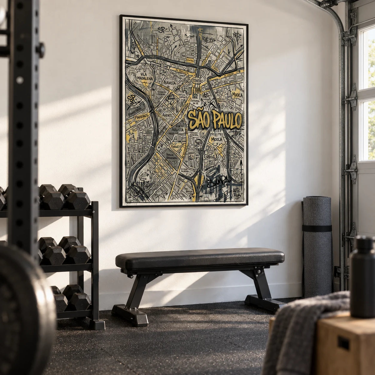 Sao Paulo Map Art, framed on the wall of a clean home gym in a garage with a white wall and black rubber flooring