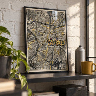 Sao Paulo Map Art, a small A4 framed print leaning on a black metal shelf in a living room