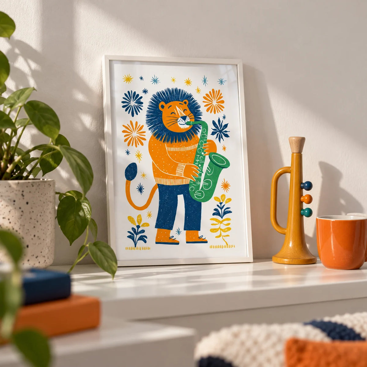 Saxophone Lion Art Print, a small A4 framed print leaning on a white shelf in a living room