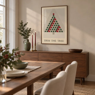 Scandinavian Christmas Print, framed on the wall of a modern dining room in a UK flat with a pale greige wall and simple walnut furniture