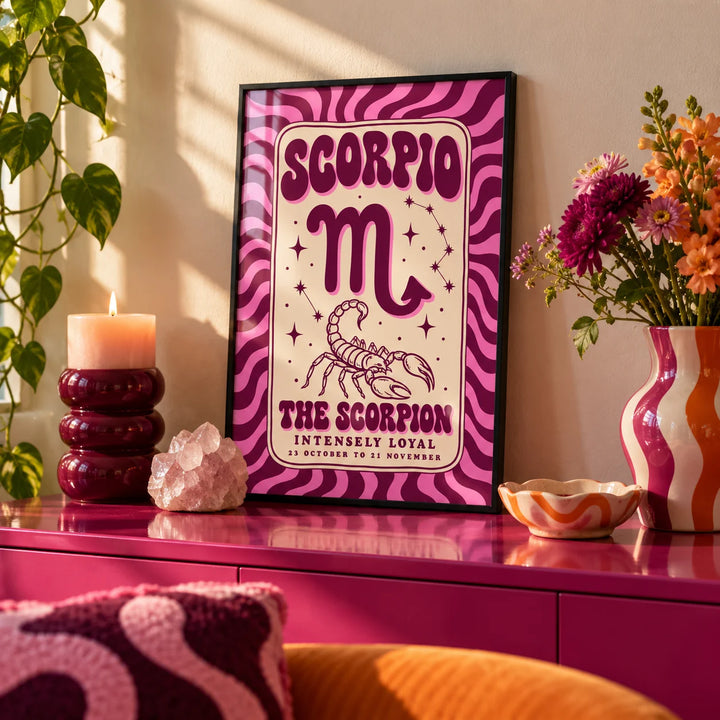 Scorpio Print, a small A4 framed print leaning on a colourful lacquered shelf in a living room