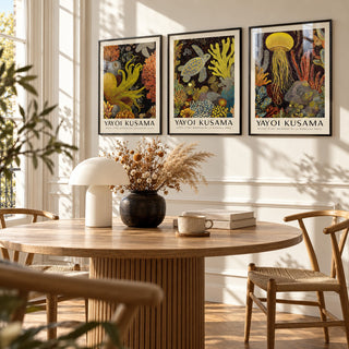 Sea Life Prints Set of 3 styled above a round fluted oak dining table with a mushroom lamp: Golden Tentacle, Turtle Drift and Luminous Drift shown framed side by side (frames not included)