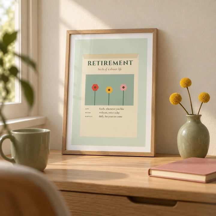Seed Packet Poster, a small A4 framed print leaning on a pale oak writing desk