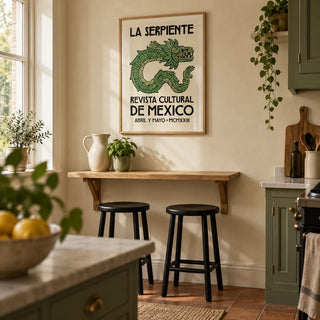 Serpent Cultural Art Print, framed on the wall of a compact characterful kitchen in a UK Victorian terrace with muted green cabinets